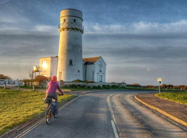 Cycling past Old Hunstanton Lighthouse