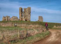 Cyclist and Castle in Norfolk