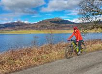 cyclist in orange jacket