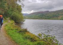 gravel cyclist on loch venachar path