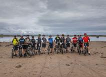 Group biking on beach