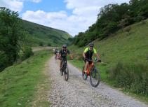 Mountain bike through green hills