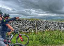 Mountain bikers and drystone wall
