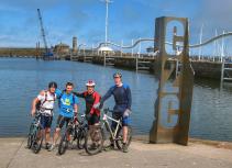 Mountain bikers at C2C sign