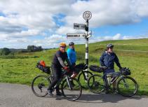 Cycling group with road signs