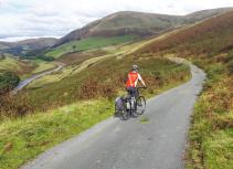 Cycling in hillside landscape