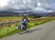 Cycling in landscape with mountains