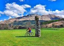 Cyclists near standing stone