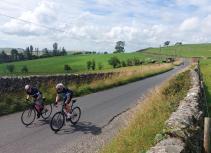 Cyclists racing on country road