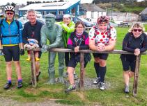 Cyclists with statue