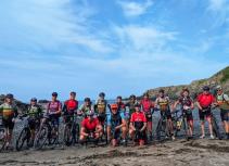 Mountain biking group on a beach