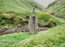 Mountain biking over wooden bridge