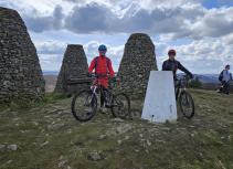 Mountain biking peak with stone markers
