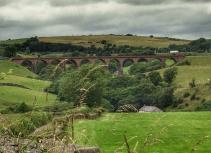 Viaduct with rolling hills