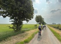 Cycling through green fields