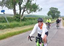 smiling female cyclist Yorkshire roads